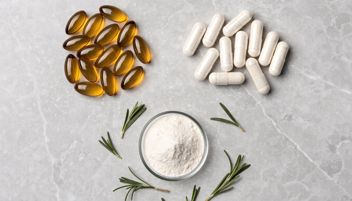 Omega-3 softgels, capsules, magnesium powder and herbs arranged in clusters