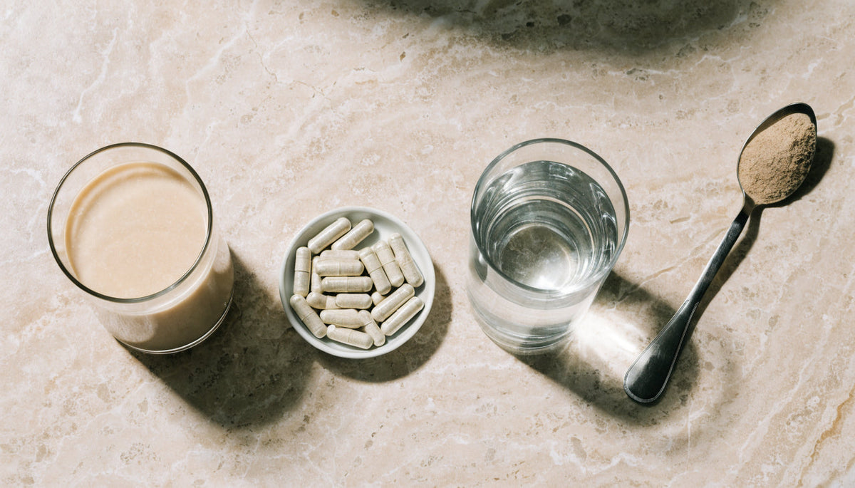 Protein shake, capsules, water and fibre arranged as a companion checklist