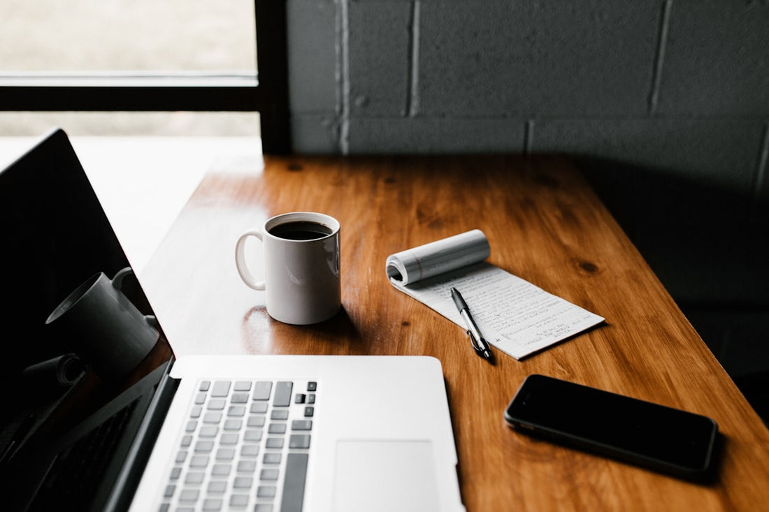 Person focused at a clean minimal desk