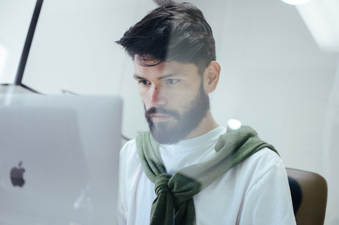 Person focused at laptop