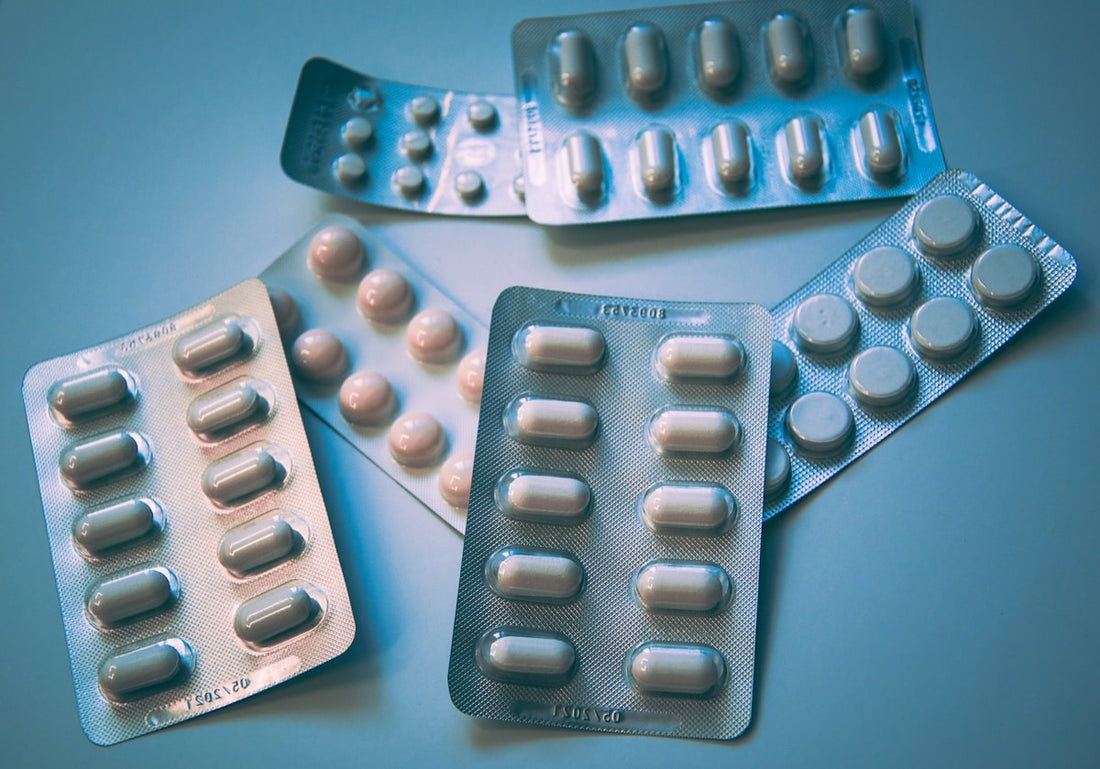 Prescription pill bottles on a white surface