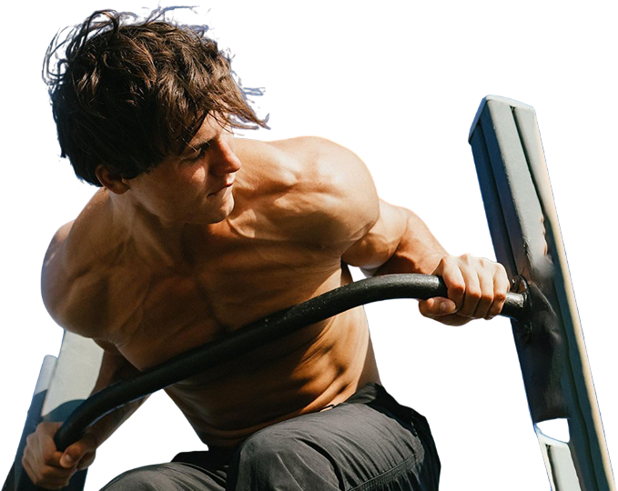 Man exercising on some dip bars against a blue sky background